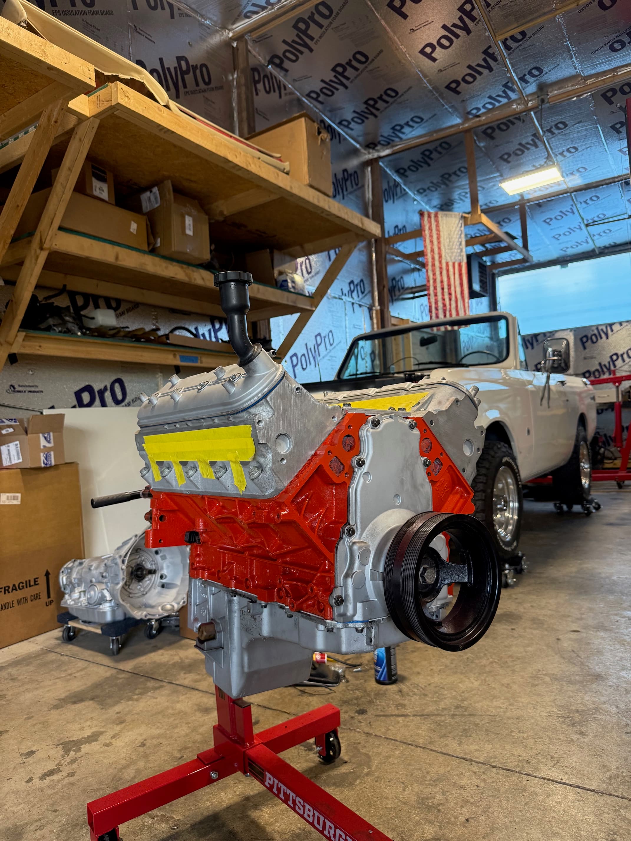 Engine bay service work inside the SWR Automotive shop
