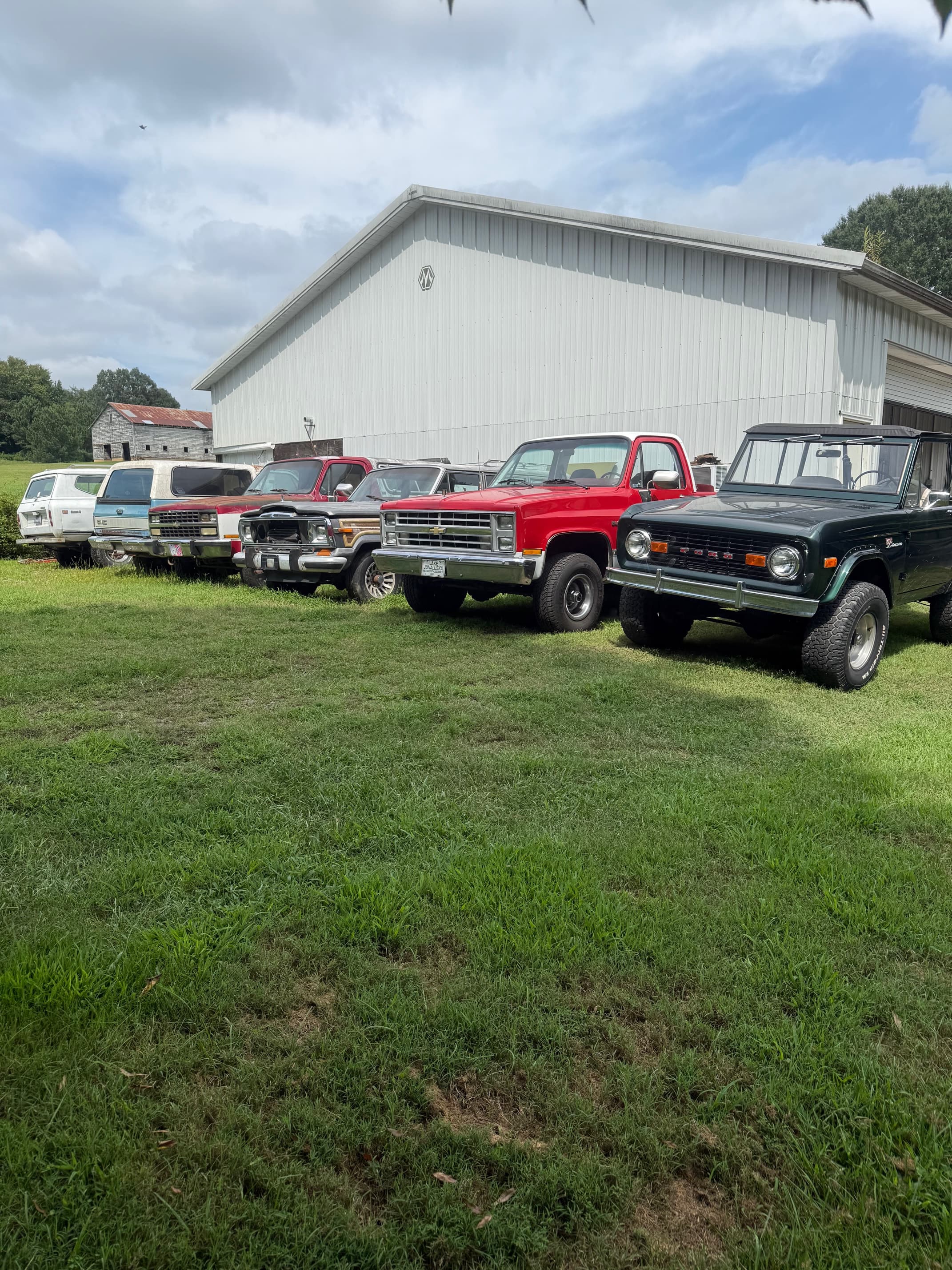 Vintage SUV and truck lineup at SWR Automotive shop